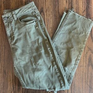 American Eagle X-Long ripped green jeans.